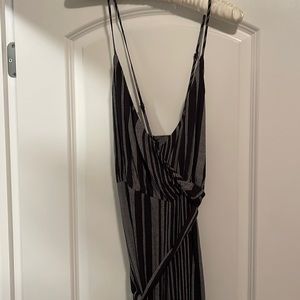 Very cute deep v cross front jumpsuit with adjustable straps and tie waist